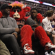 Benny the Bull sits with fans on the sidelines at the United Center.